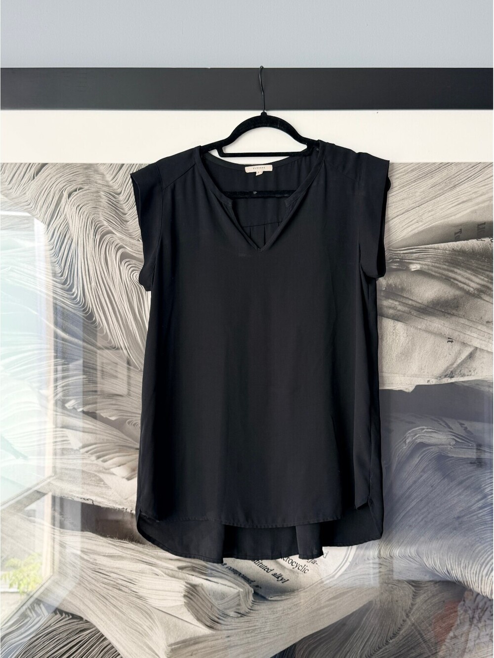 Black sleeveless V-neck top